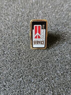 Vintage Oldsmobile Service Enamel Pin - Red, Black, White, Gold.